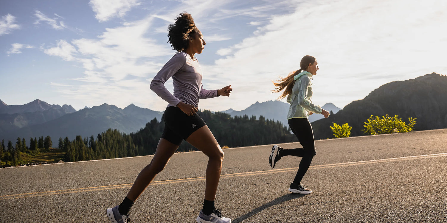 Women running on road wearing Superfeet active insoles.